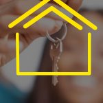 Close-up of hands holding house keys with yellow house icon overlay, representing real estate.